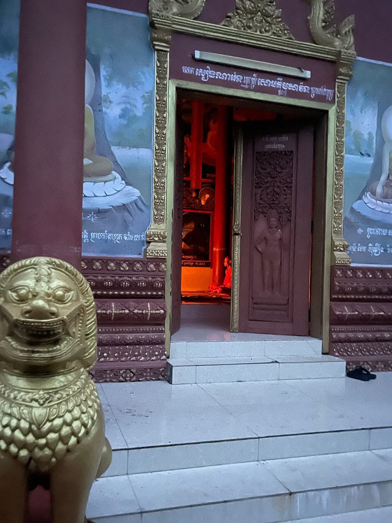 Carved Khmer doorway of a working pagoda in Siem Reap